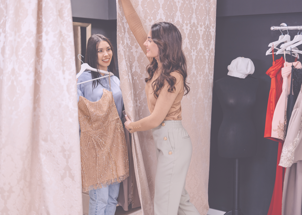 A White Oak stylist helping a client find her dress